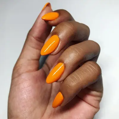 close up of bright orange nails