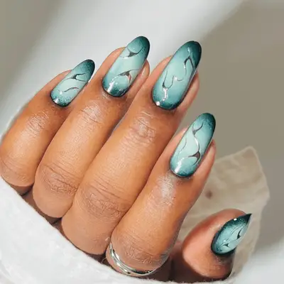 midnight green and light green aura manicure with silver chrome accents