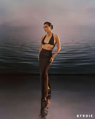 Eva Longoria poses against an oceanic background for MYM Beauty