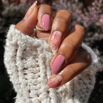 A close up of pink mauve florals with mauve accent nails.