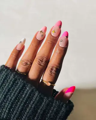 French manicure with pink tips and studded accents