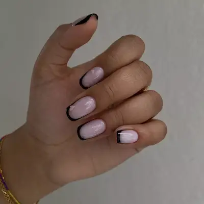 french manicure with black tips and pink heart accent designs 