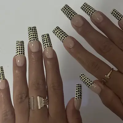 yellow and black polka dot french manicure
