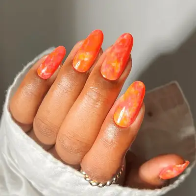 orange and pink watercolor-inspired manicure