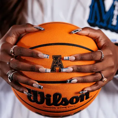 navy blue and orange art deco manicure