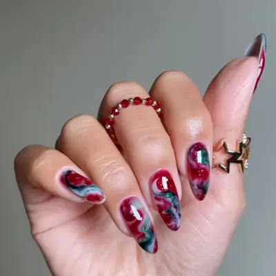 red, dark red, and gray marble manicure