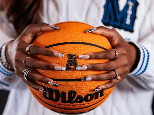 ARLINGTON, TEXAS - OCTOBER 13: A detailed view of the nails worn by Alex Simmons head coach of The University of Memphis during the American Athletic Conference Basketball Media day at The Westin Irving Convention Center at Las Colinas on October 13, 2024 in Irving, Texas. (Photo by Andrew Wevers/Getty Images)
