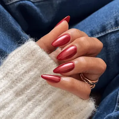 almond shaped nails with red chrome polish.