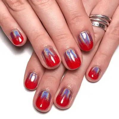 Red snake print chrome nails.