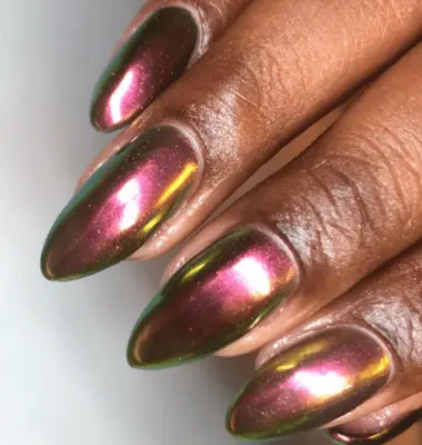 Very long red chrome sparkly nails.