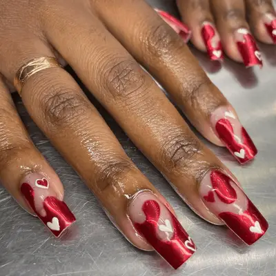 Nude nails with red chrome fire.