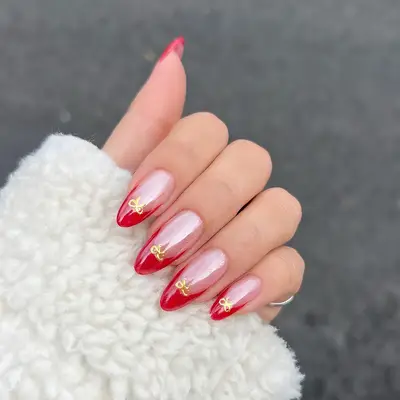 a glazed-donut red french tip manicure