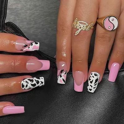 Pink and cow print manicure