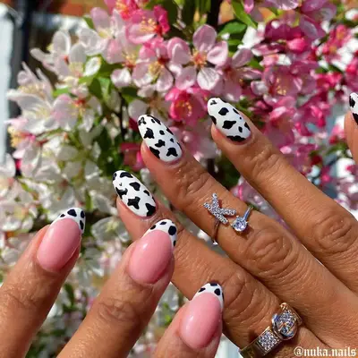 Mix and match cow print French manicure