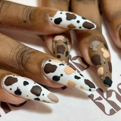 Brown and white cow print manicure