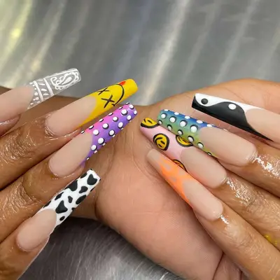 French manicure with bright mismatched art on the tips