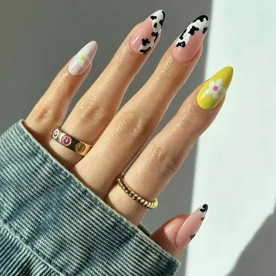 Cow print and floral manicure