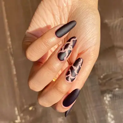 Matte brown cow print manicure
