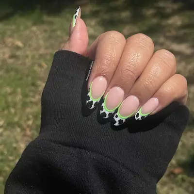 Neon outlined cow-print French manicure