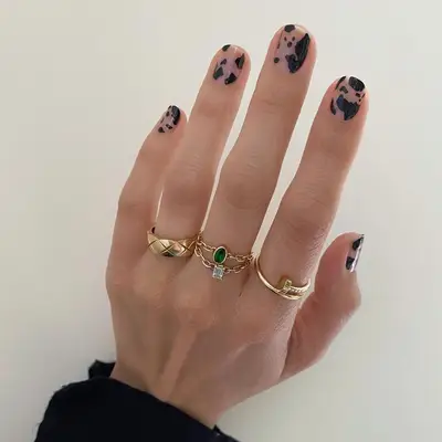 Sheer cow print nails