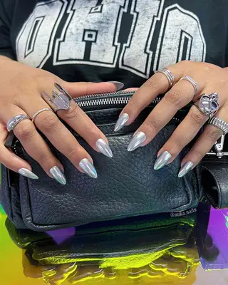 Pastel pink manicure with abstract silver chrome nail designs