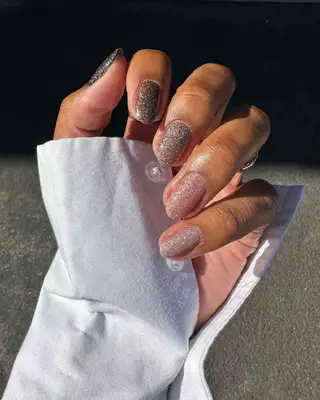 Minimalist neutral manicure with abstract silver chrome designs