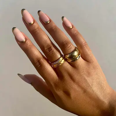 Gold half moon cuticle and tip nail design