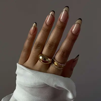 Black and muted gold French tip manicure