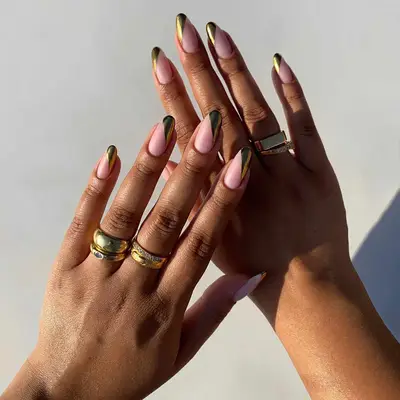Gold diagonal tip mani with pale pink nail