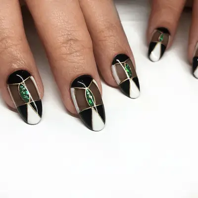 Manicure with brown, pink, and white color block nail design and sparkle details