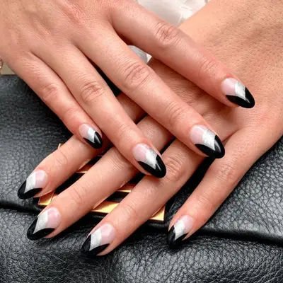 Manicure with matte black art deco fan design and small gems