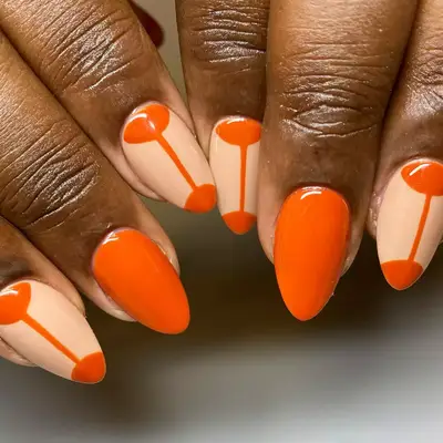 opaque orange nails with orange retro design accent nails