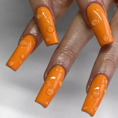 long orange square nails with water drop wet design