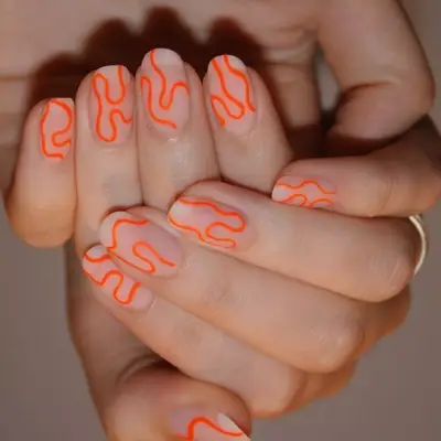 natural nails with neon orange swirl line design