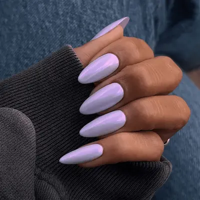 A light lavender chrome manicure with stiletto tips