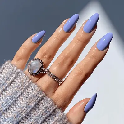 Close up of a chic, solid-color periwinkle manicure