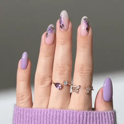 Close up of light purple nails with lavender bouquet art.