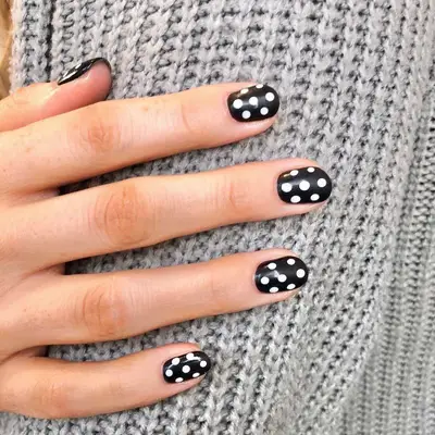 Black-and-white polka dot manicure