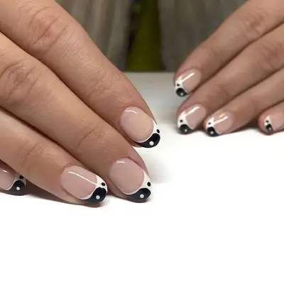 Black-and-white yin and yang French manicure