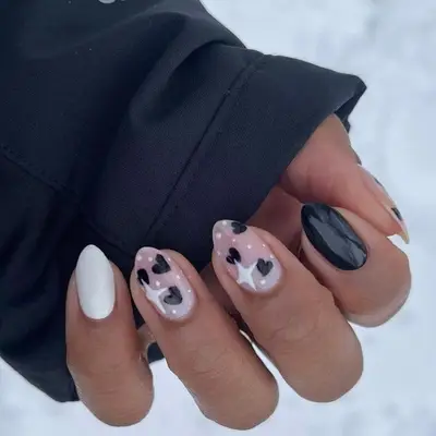 Black-and-white nails with sparkling heart designs