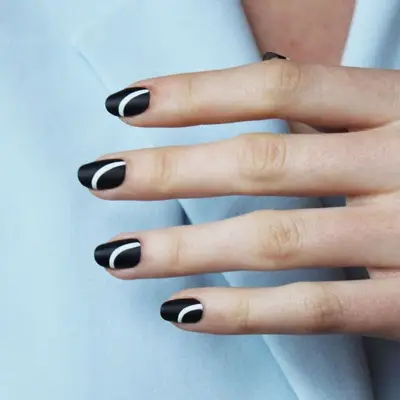 Black nails with white curved stripes