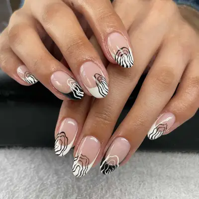 Black and white rounded French tips with trippy overlapping squiggle designs