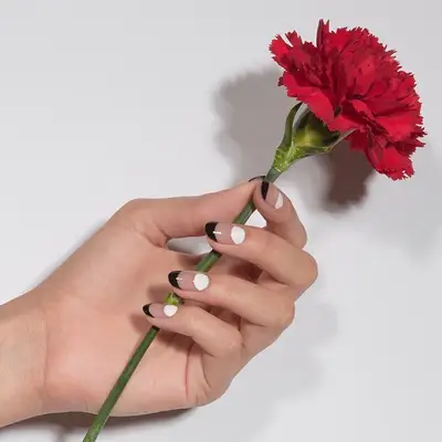 Black-and-white manicure with half-moon designs