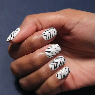 Short nails with black-and-white tiger print designs