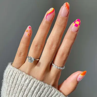 Pink, orange, and yellow mismatched checkerboard nails