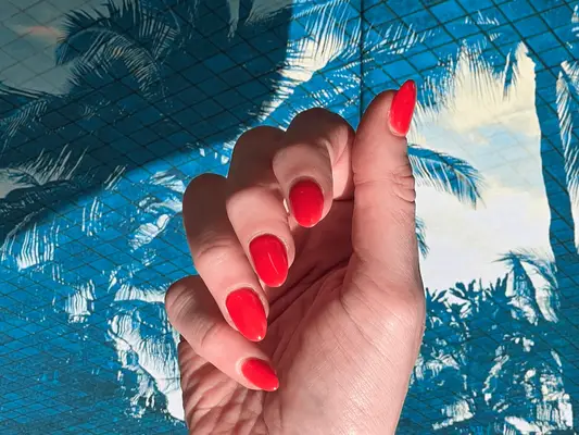 Blood orange nails on a blue background