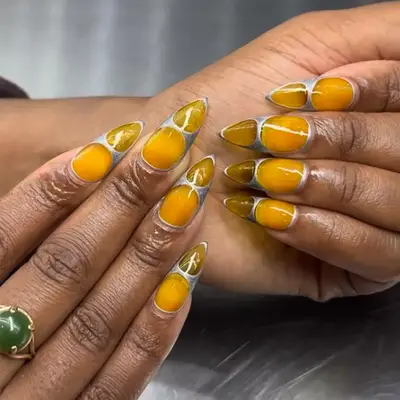 Yellow sheer jelly nails with silver chrome accents