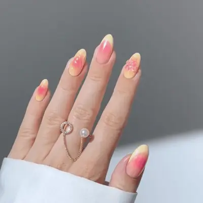 A hand with abstract chrome lemonade gradient nail art design