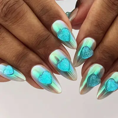 Chrome nails designed with aqua heart decorations
