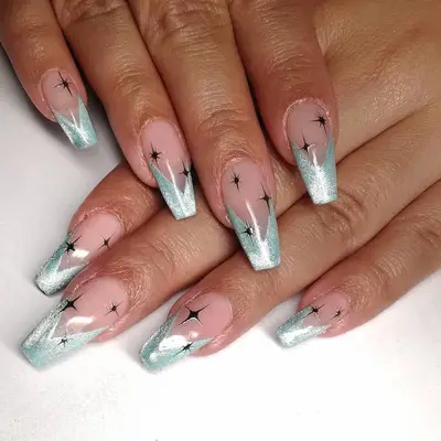 Coffin nails with silver stiletto tips and black sparkle details